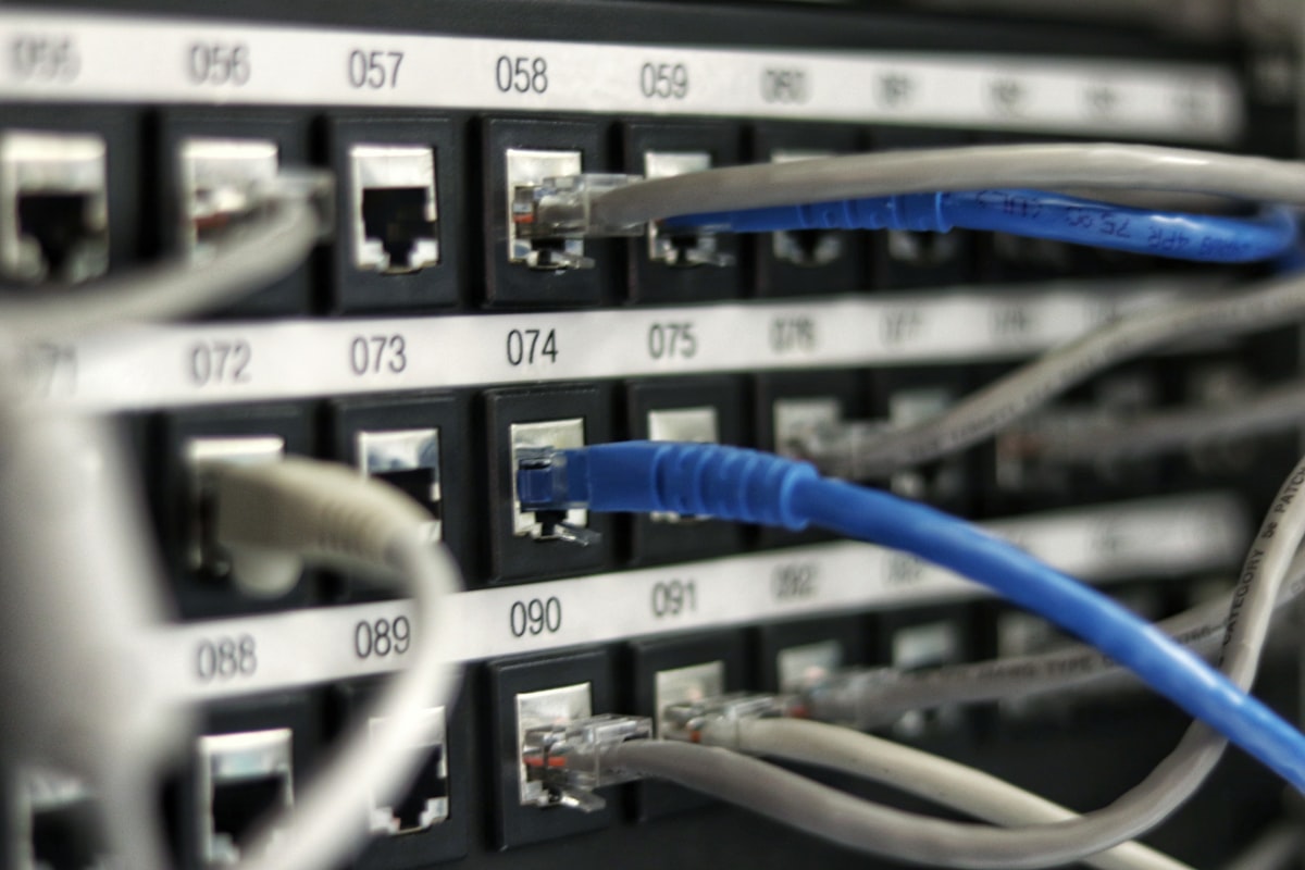 Modern UniFi wireless access point mounted in a professional office providing enterprise WiFi coverage